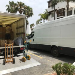 Removals team loading boxes for a house clearance in Spain